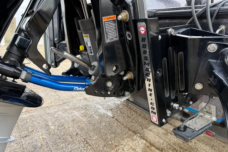 Slide: The Image of 2018 Blazer 625 Pro Elite boat with Mercury engine on trailer in parking lot. - 13