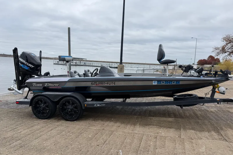 Slide: The Image of 2018 Blazer 625 Pro Elite boat motor mount with hydraulic components and branding. - 17