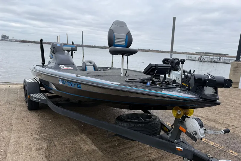 Slide: The Image of 2018 Blazer 625 Pro Elite boat on trailer by the water. - 19