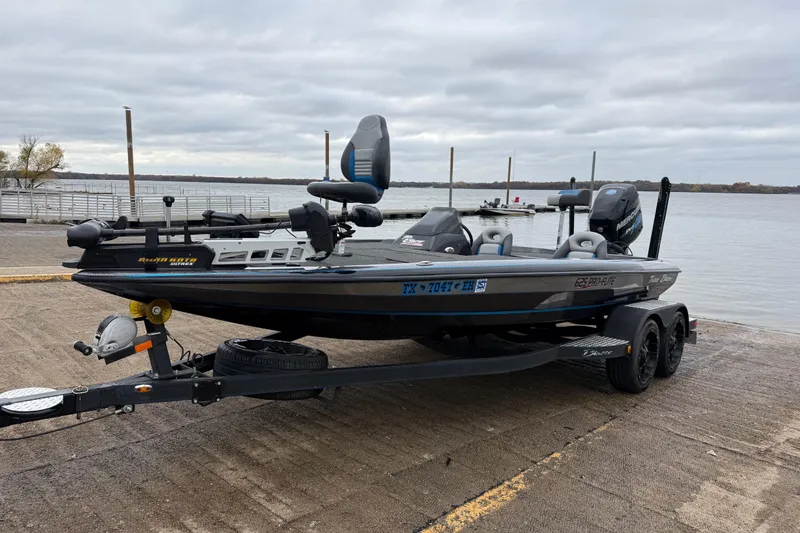 Slide: The Image of 2018 Blazer 625 Pro Elite boat with 250 Pro engine, parked on a concrete surface. - 2