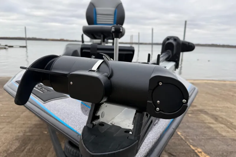 Slide: The Image of 2018 Blazer 625 Pro Elite boat with trolling motor on a lake. - 22