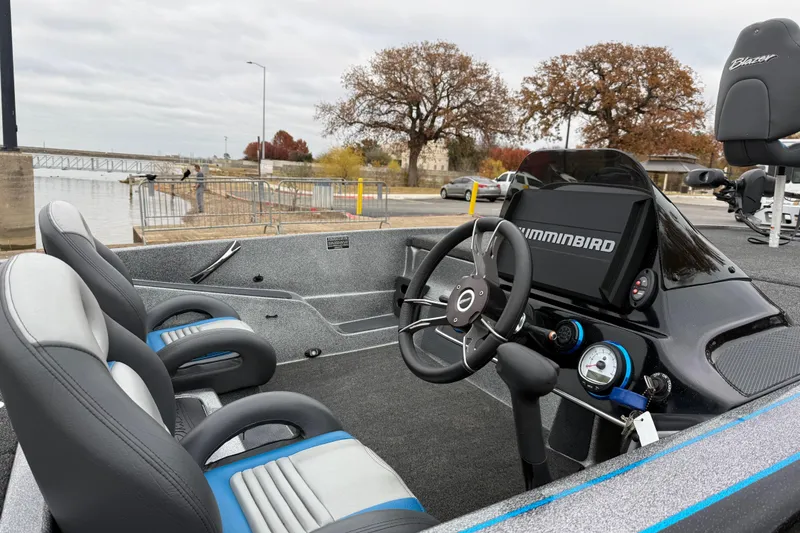 Slide: The Image of 2018 Blazer 625 Pro Elite boat interior with steering wheel and Humminbird display. - 29