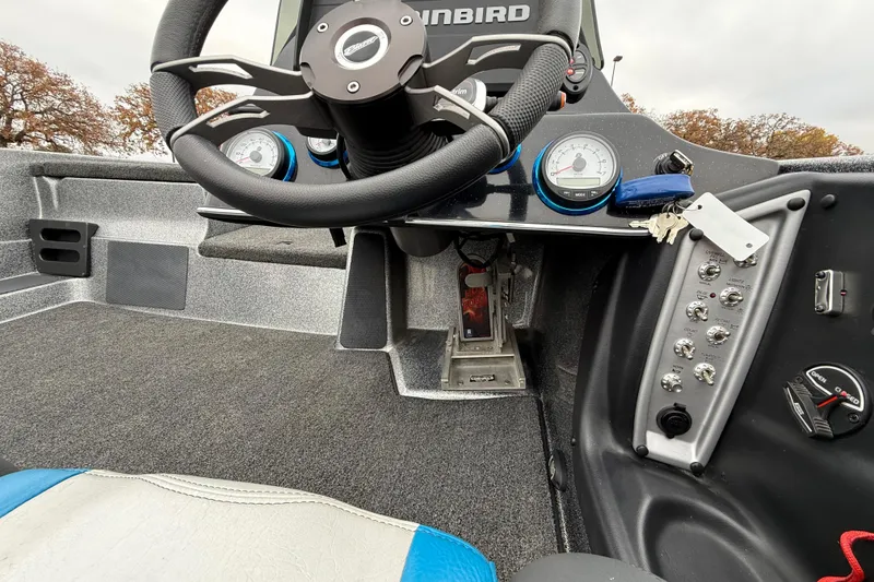 Slide: The Image of Interior of 2018 Blazer 625 Pro Elite boat with steering wheel and control panel. - 30