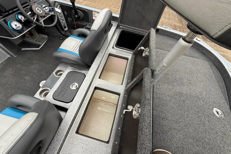 Slide: The Image of 2018 Blazer 625 Pro Elite boat interior with open storage compartments and seating. - 34