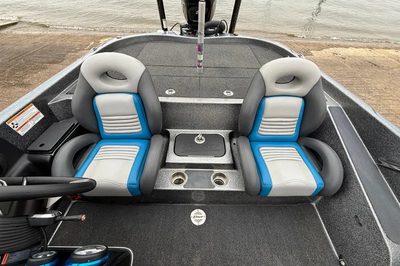 Slide: The Image of 2018 Blazer 625 Pro Elite boat interior with dual seats and steering wheel. - 36