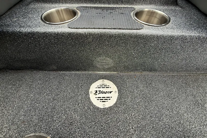 Slide: The Image of 2018 Blazer 625 Pro Elite boat interior with cup holders and textured flooring. - 37