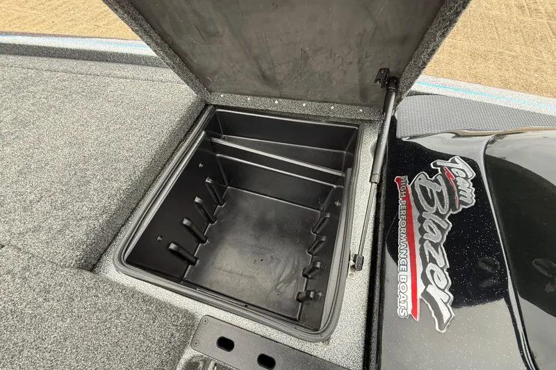 Slide: The Image of Open storage compartment on 2018 Blazer 625 Pro Elite high-performance boat. - 40