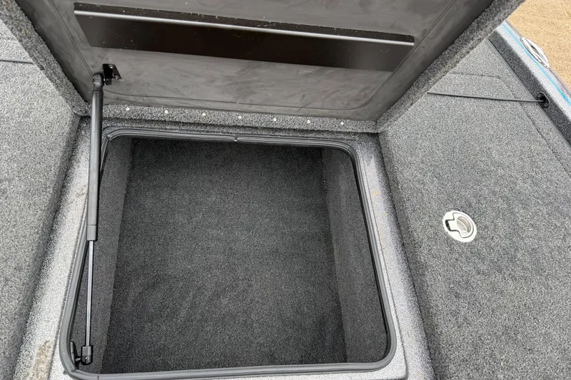 Slide: The Image of Open storage compartment in 2018 Blazer 625 Pro Elite boat. - 42