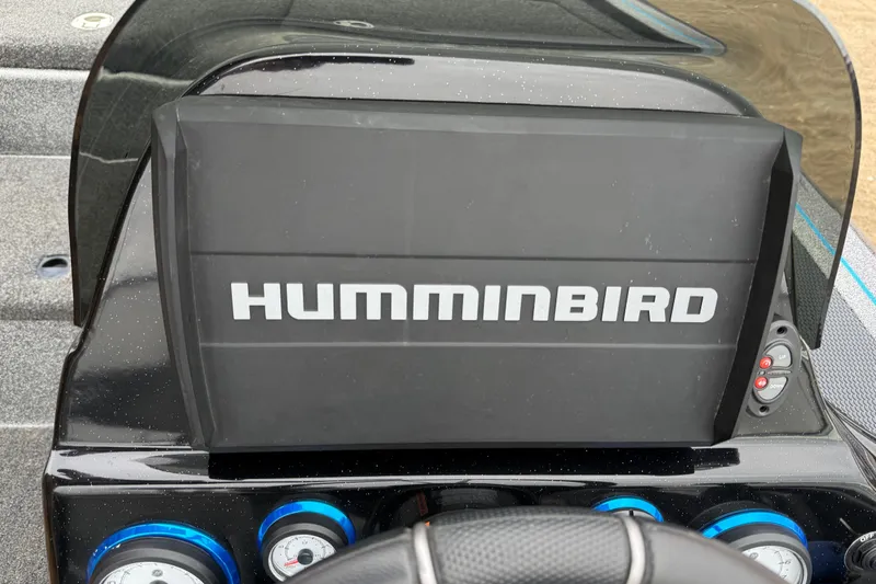 Slide: The Image of Remote controls on a blue and gray seat of a 2018 Blazer 625 Pro Elite. - 48