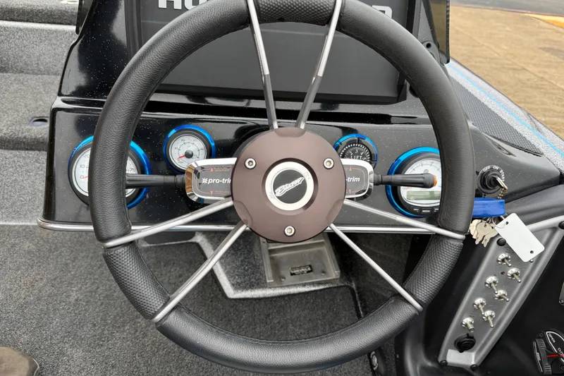 Slide: The Image of Dashboard of 2018 Blazer 625 Pro Elite boat with lift plate and RPM gauge. - 49