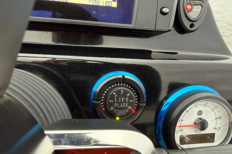 Slide: The Image of Dashboard of 2018 Blazer 625 Pro Elite with lift plate and RPM gauge. - 54