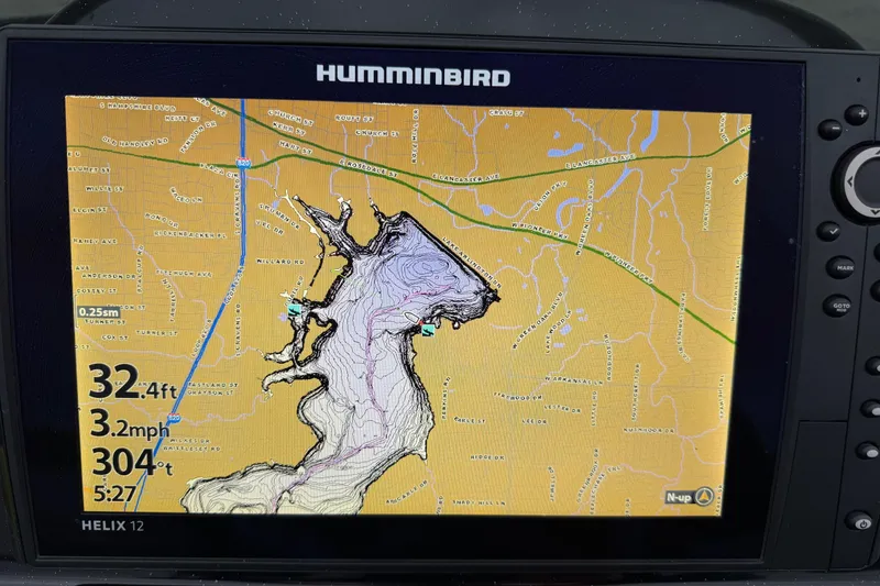Slide: The Image of Humminbird Helix 12 GPS display showing detailed lake map and navigation data. - 58