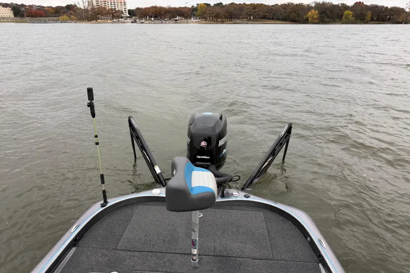 Slide: The Image of 2018 Blazer 625 Pro Elite boat on a lake, featuring a Mercury outboard motor. - 59