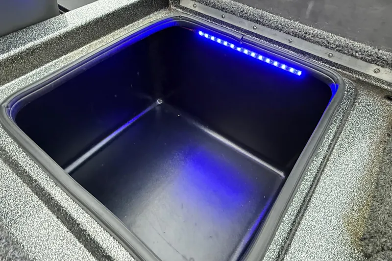 Slide: The Image of 2018 Blazer 625 Pro Elite boat compartment with blue LED lighting. - 64