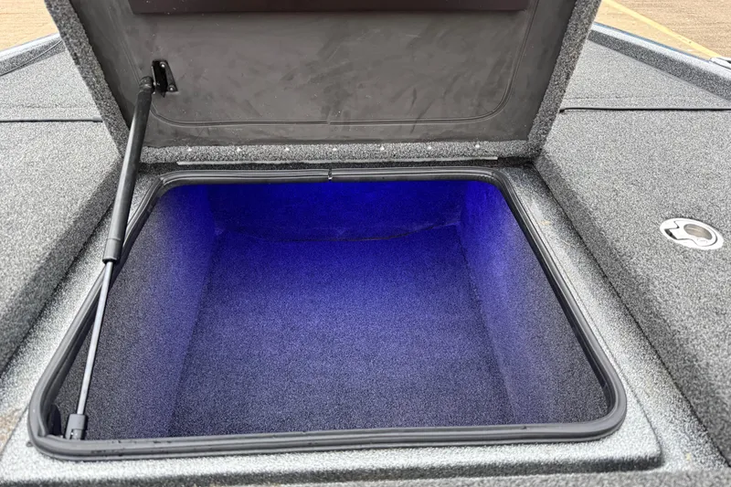 Slide: The Image of Open storage compartment with blue lighting in 2018 Blazer 625 Pro Elite boat. - 65