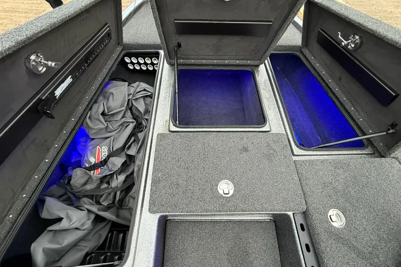Slide: The Image of 2018 Blazer 625 Pro Elite boat storage compartments with blue interior lighting. - 67