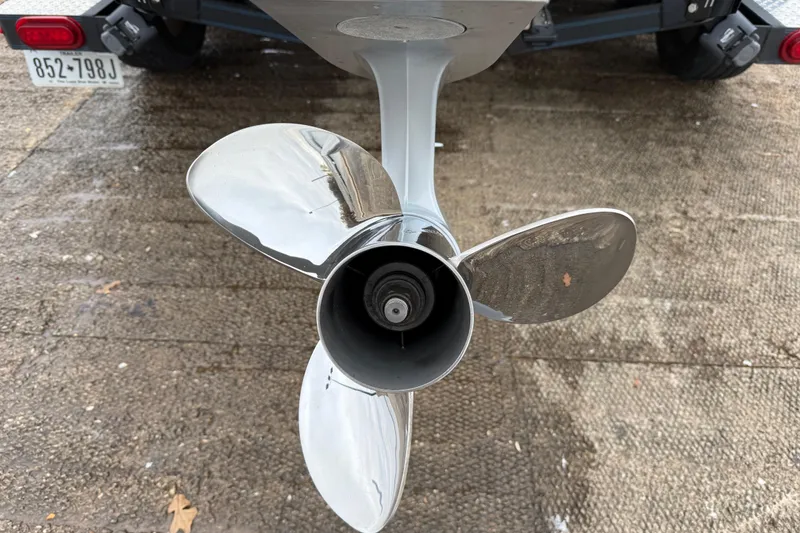 Slide: The Image of 2018 Blazer 625 Pro Elite boat on trailer by a lake under cloudy skies. - 9