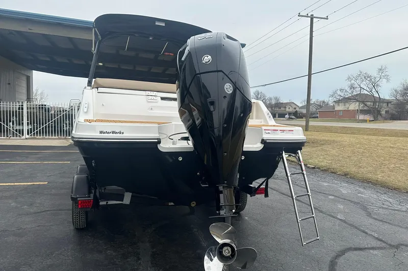 Slide: The Image of 2025 Bayliner VR6 Bowrider OB with outboard motor, parked on a trailer. - 3