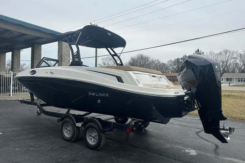 Slide: The Image of 2025 Bayliner VR6 Bowrider OB on trailer, featuring sleek design and powerful outboard motor. - 4