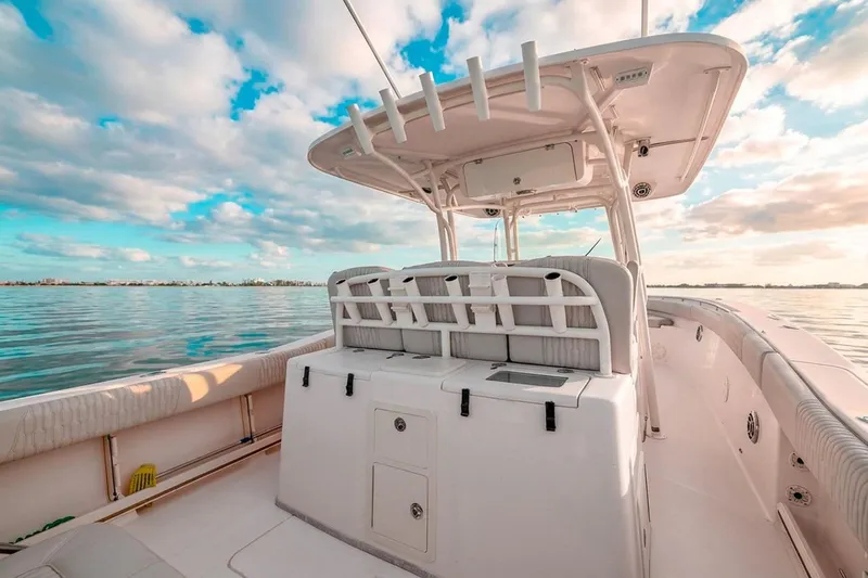 Slide: The Image of 2014 Grady-White Canyon 336 boat on calm water under a vibrant sky. - 12