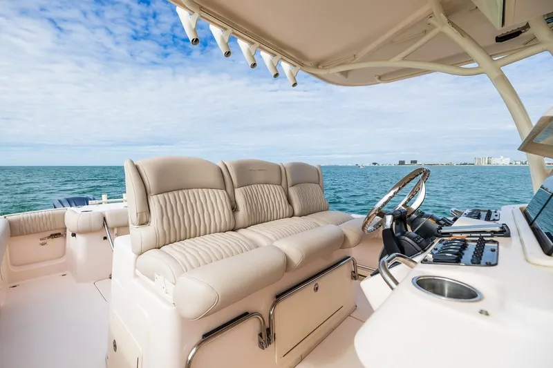 Slide: The Image of 2014 Grady-White Canyon 336 boat interior with luxurious seating and ocean view. - 17