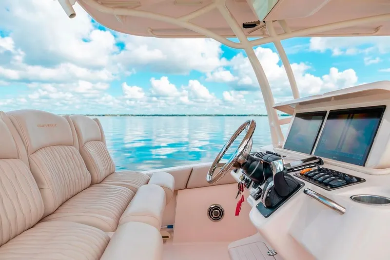 Slide: The Image of 2014 Grady-White Canyon 336 boat interior with plush seating and advanced navigation system. - 20