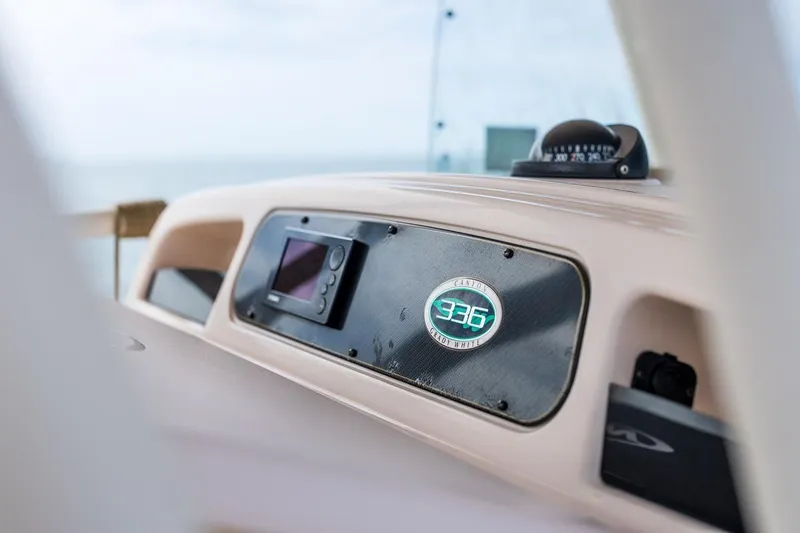Slide: The Image of Dashboard of 2014 Grady-White Canyon 336 boat with navigation instruments. - 23