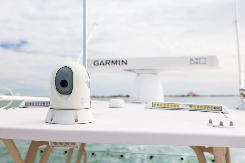 Slide: The Image of 2014 Grady-White Canyon 336 boat with Garmin radar and FLIR camera on deck. - 25