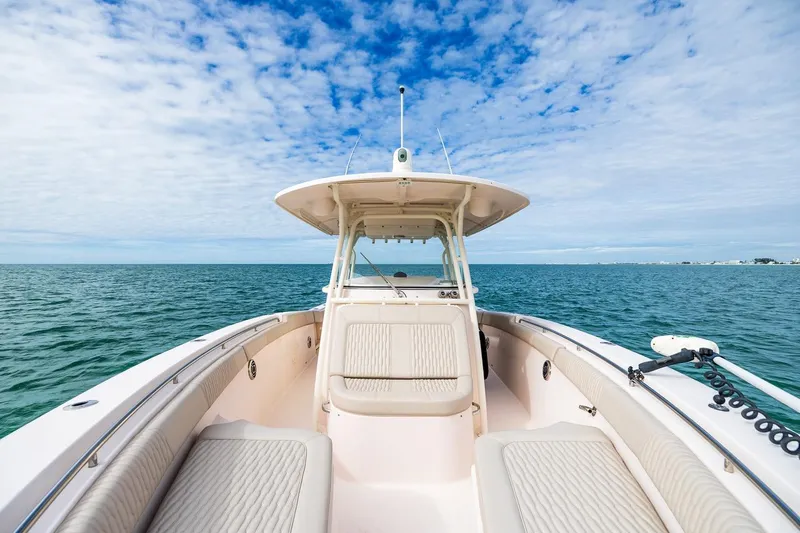 Slide: The Image of 2014 Grady-White Canyon 336 boat on open sea under blue sky. - 29