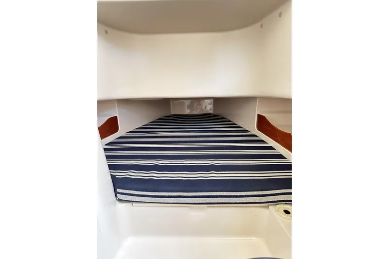 Slide: The Image of 2014 Grady-White Canyon 336 cabin interior with striped cushion. - 34