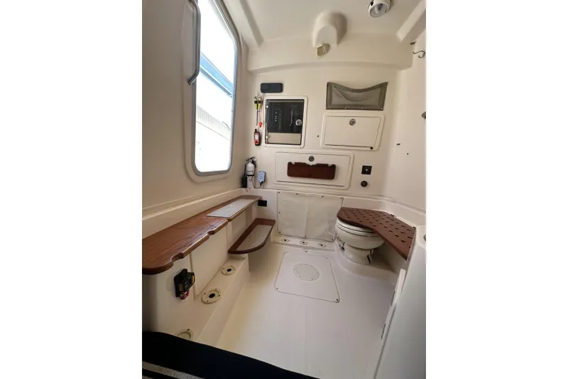 Slide: The Image of 2014 Grady-White Canyon 336 boat interior with seating and storage. - 35