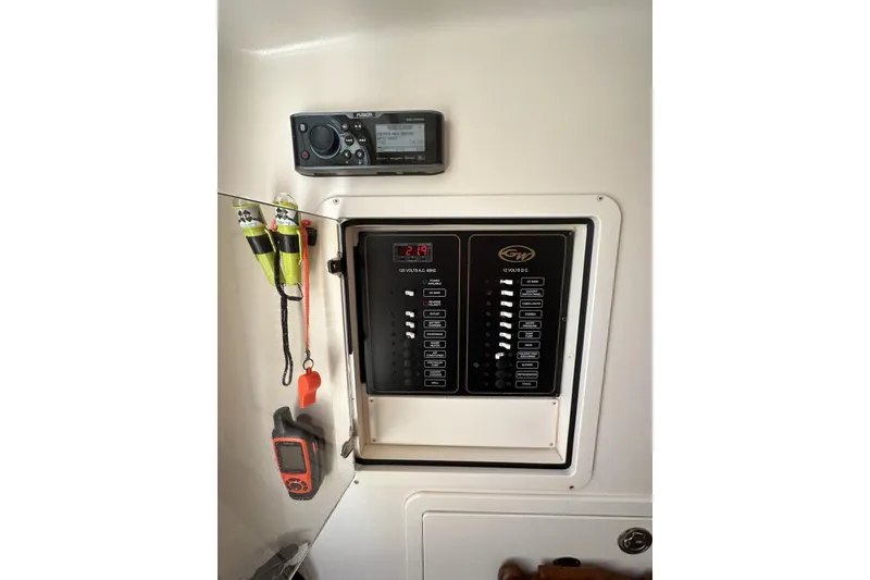 Slide: The Image of 2014 Grady-White Canyon 336 control panel with radio and safety equipment. - 38