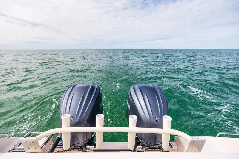 Slide: The Image of 2014 Grady-White Canyon 336 boat with twin outboard motors on open sea. - 41
