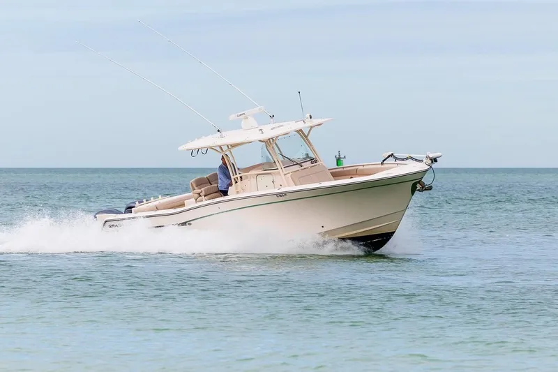 Slide: The Image of 2014 Grady-White Canyon 336 boat cruising on open water. - 42