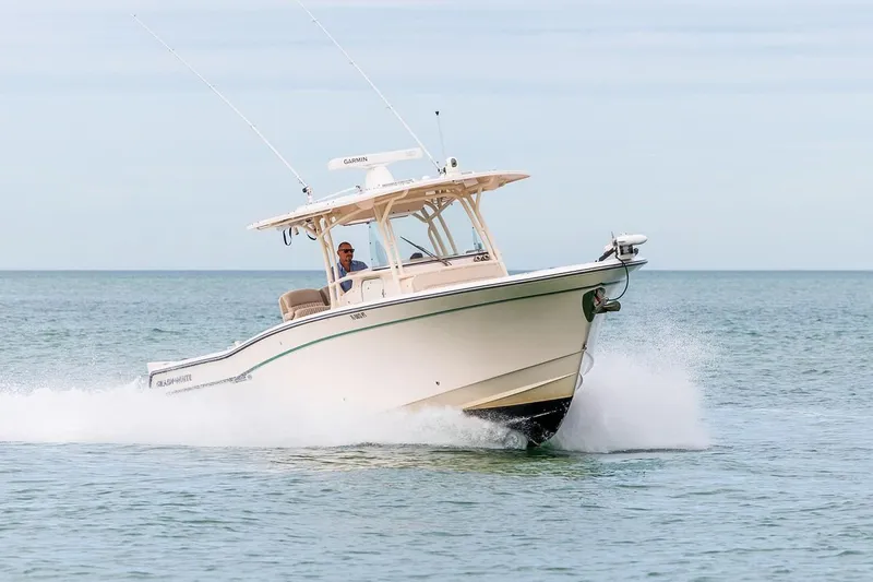 Slide: The Image of 2014 Grady-White Canyon 336 boat cruising on open water. - 6