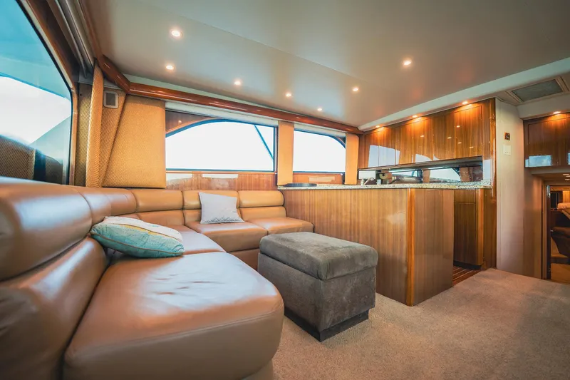 Slide: The Image of Luxurious interior of 2005 Viking 48 Convertible yacht with leather seating and wooden finishes. - 12