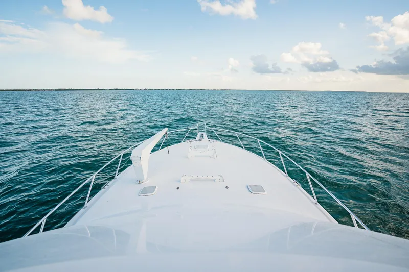 Slide: The Image of Bow view of 2005 Viking 48 Convertible yacht cruising on open sea. - 40