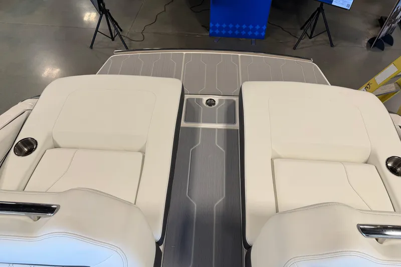 Slide: The Image of 2026 Regal LS6 Surf boat interior with white seating and sleek design. - 11