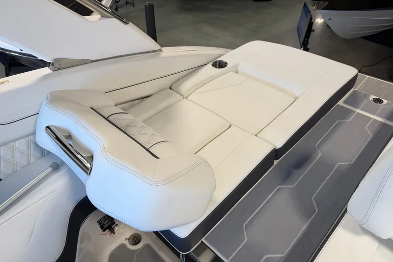 Slide: The Image of Luxurious seating on 2026 Regal LS6 Surf boat, featuring sleek white upholstery and modern design. - 12