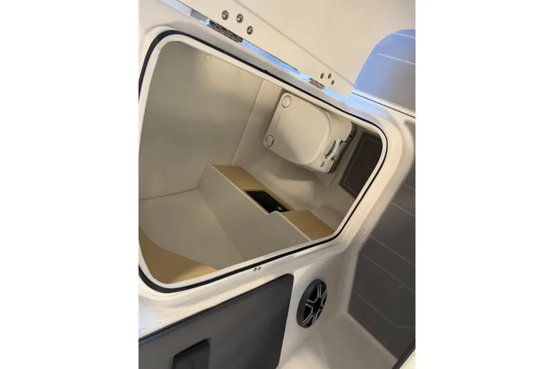 Slide: The Image of Interior view of 2026 Regal LS6 Surf boat's storage compartment. - 20