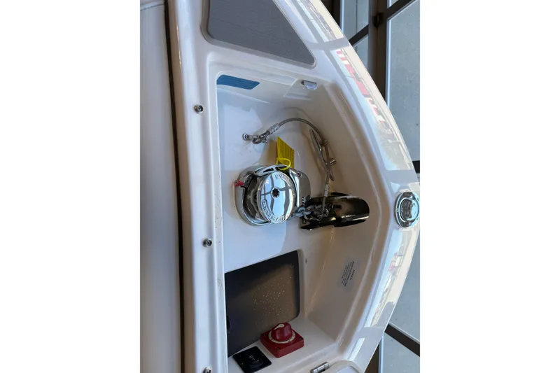Slide: The Image of 2026 Regal LS6 Surf boat interior detail with chrome fixtures and control panel. - 21