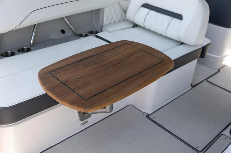 Slide: The Image of Manufacturer Provided Image: Luxurious interior of 2026 Regal LS6 Surf boat with elegant wooden table. - 5
