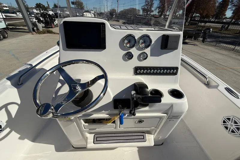 Slide: The Image of 2023 Tidewater 198 CC Adventure boat console with steering wheel and gauges. - 14