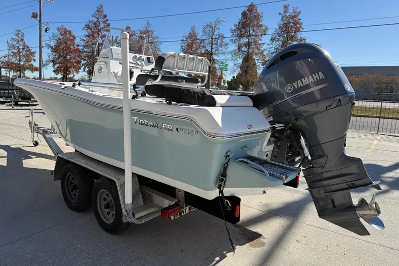Slide: The Image of 2023 Tidewater 198 CC Adventure boat on trailer with Yamaha outboard motor. - 5