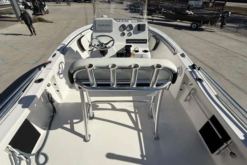 Slide: The Image of 2023 Tidewater 198 CC Adventure boat interior with Garmin navigation system and rod holders. - 8