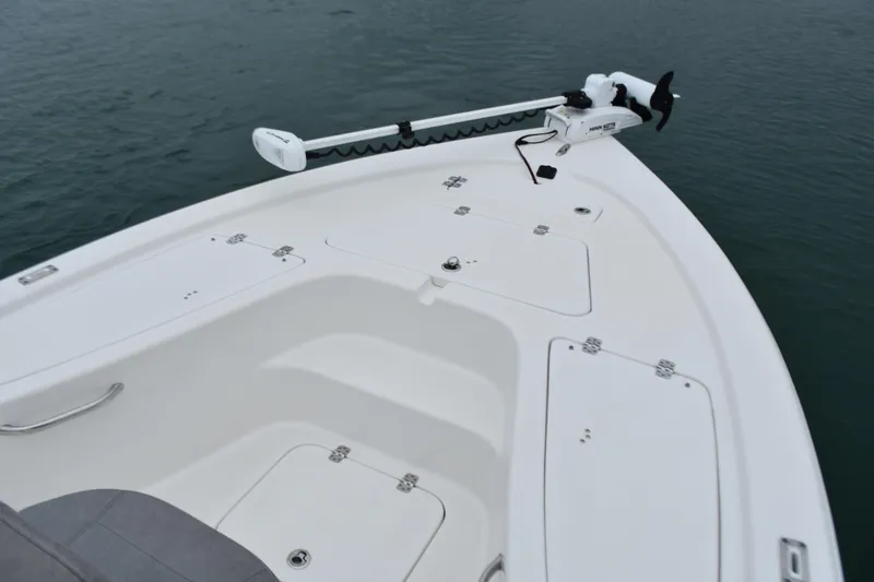 Slide: The Image of 2020 Sea Pro 208 Bay boat bow with storage compartments and trolling motor. - 11