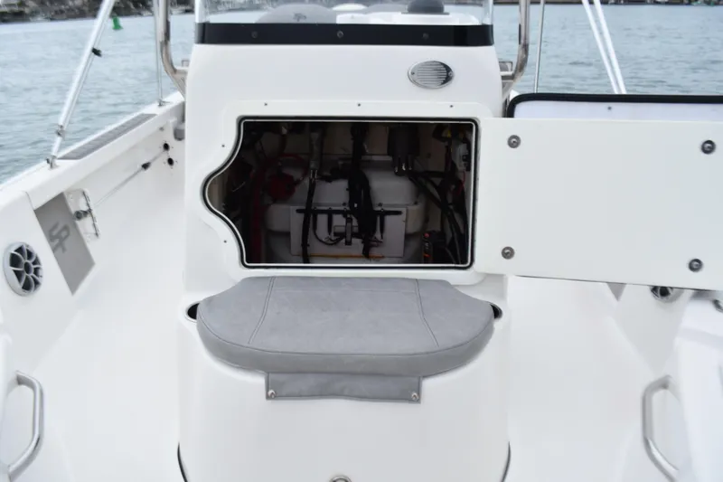 Slide: The Image of 2020 Sea Pro 208 Bay boat interior with open storage compartment and seating. - 17