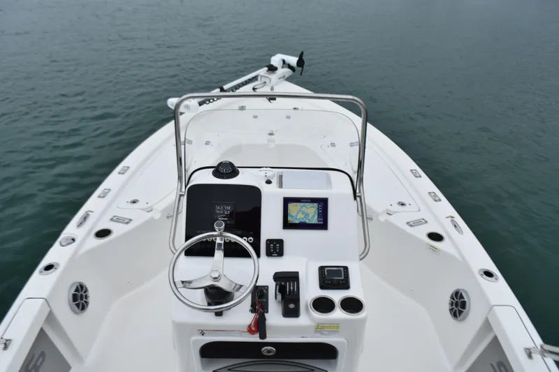 Slide: The Image of 2020 Sea Pro 208 Bay boat dashboard with steering wheel and navigation system. - 19