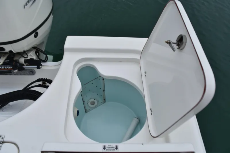 Slide: The Image of 2020 Sea Pro 208 Bay boat livewell with open lid, showing interior details. - 24