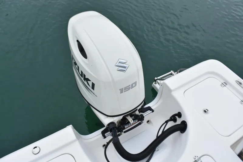 Slide: The Image of 2020 Sea Pro 208 Bay boat with Suzuki 150 outboard motor on calm water. - 27